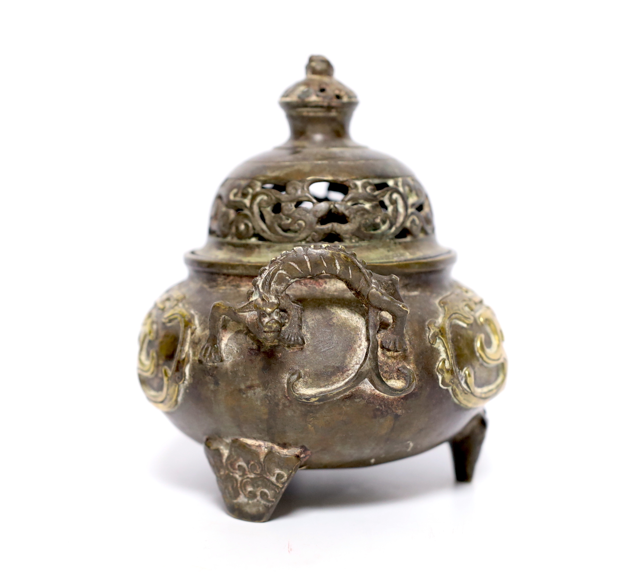 A Chinese parcel gilt bronze censer, with pierced lid and twin zoomorphic handles, 15cm high